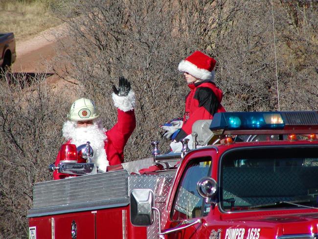 Santa waving from a firetruck 